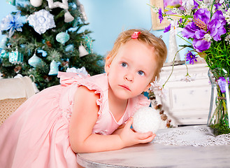 Image showing Girl decorate the Christmas tree