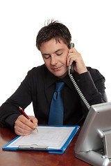 Image showing Businessman or doctor filling out form