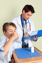 Image showing Sick child taking medicine