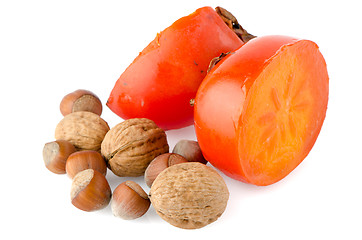 Image showing Ripe persimmons and nuts