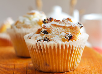 Image showing Sweet Muffins with tea on the table