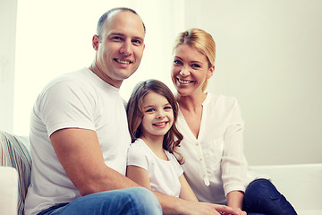 Image showing happy parents with little daughter at home