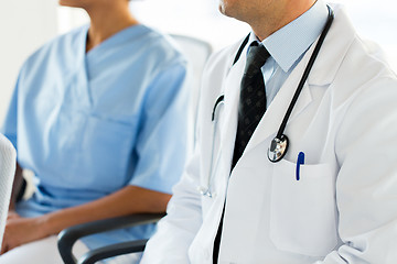 Image showing close up of happy doctors at seminar or hospital