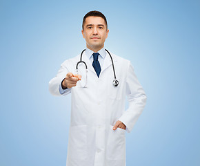 Image showing male doctor in white coat pointing at you