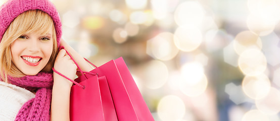 Image showing smiling young woman with shopping bags