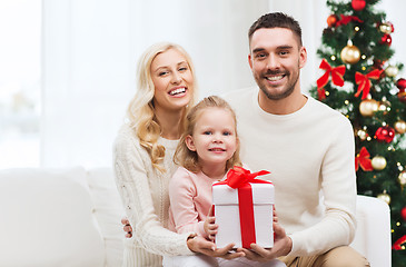 Image showing happy family at home with christmas gift box