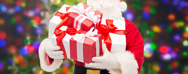 Image showing man in costume of santa claus with gift boxes