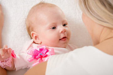 Image showing The two-month baby looking at mother