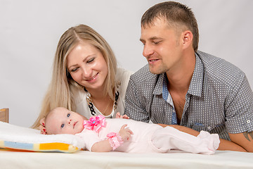 Image showing Mom and Dad are considering their two-month baby