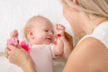 Image showing Mom kneads two-handle baby