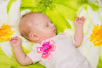 Image showing The two-month baby carefree sleeping on the bed