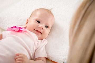 Image showing Happy smiling baby looking at mother