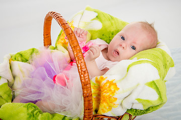 Image showing The two-month baby lying in a basket