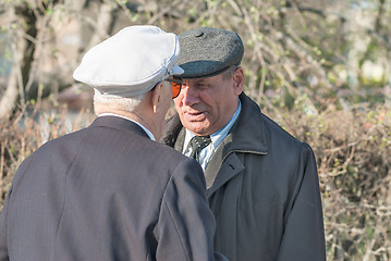 Image showing Senior veterans of World War II meet on street