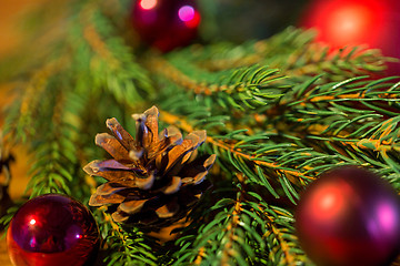 Image showing fir branch with christmas ball and pinecones