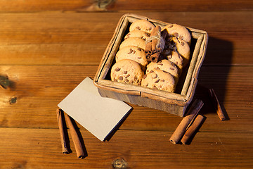 Image showing close up of oat cookies and card  on wooden table