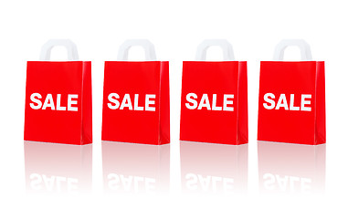 Image showing many red shopping bags with sale word