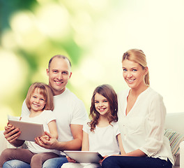 Image showing happy family with tablet pc computers