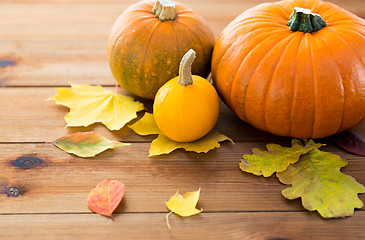 Image showing close up of pumpkins on wooden table at home