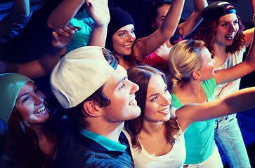 Image showing smiling friends at concert in club