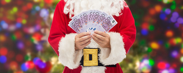 Image showing close up of santa claus with euro money