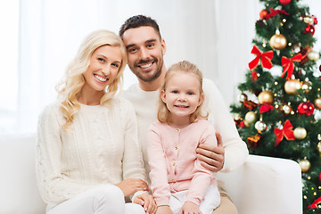 Image showing happy family at home with christmas tree