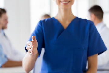 Image showing close up of doctor reaching out hand at hospital