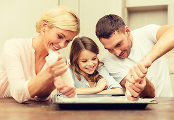 Image showing happy family in making cookies at home
