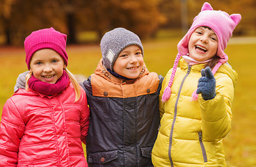 Image showing group of happy children hugging in autumn park