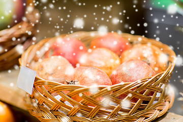 Image showing ripe pomegranates in basket at food market