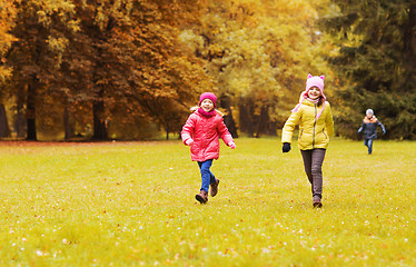 Image showing group of happy little kids running outdoors