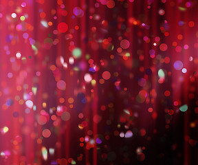 Image showing confetti against a blurred curtain background