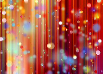 Image showing confetti against a red blurred curtain background