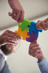 Image showing business people group assembling jigsaw puzzle