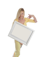 Image showing Smiling woman holding a picture painting sign message