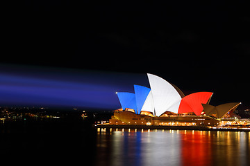 Image showing Sydney Opera House lit in colours of French Flag red white blue