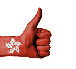 Image showing Closeup of male hand showing thumbs up sign