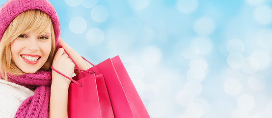 Image showing smiling young woman with shopping bags