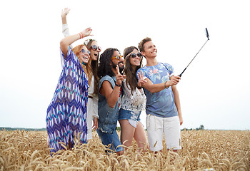 Image showing hippie friends with smartphone on selfie stick