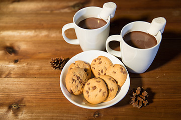 Image showing cups of hot chocolate with marshmallow and cookies