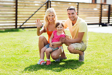 Image showing happy family hugging outdoors