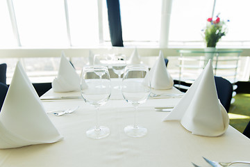 Image showing close up of table setting with glasses and cutlery