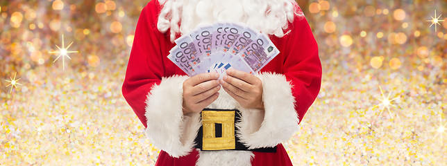 Image showing close up of santa claus with euro money