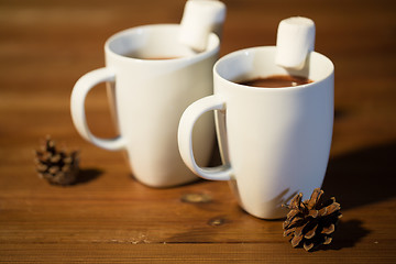 Image showing cups of hot chocolate with marshmallow on wood