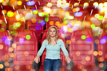 Image showing young woman watching movie in theater