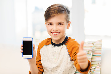 Image showing smiling boy with smartphone at home