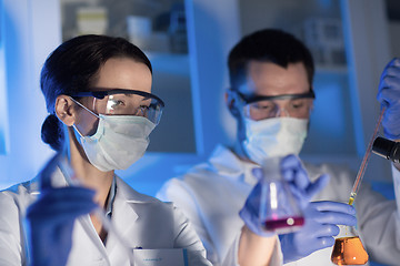 Image showing close up of scientists making test in lab