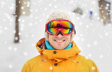 Image showing happy young man in ski goggles outdoors