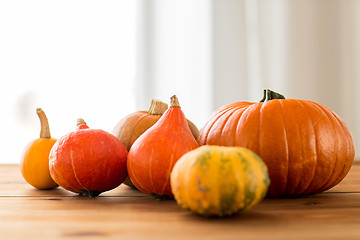 Image showing close up of pumpkins on wooden table at home