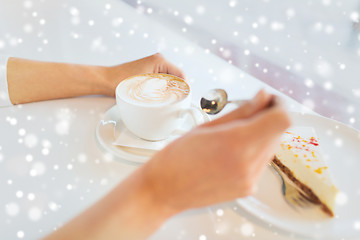 Image showing close up of woman hands with cake and coffee